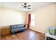 Bedroom featuring a window, futon, and laminate flooring at 600 Marion Oaks Blvd, Ocala, FL 34473