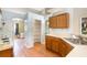 Kitchen area featuring laminate floors, a pantry and standard appliances at 600 Marion Oaks Blvd, Ocala, FL 34473