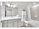 Bathroom with a large mirror, cabinets and tile in the shower at 6105 Citrus Grove Ct, St Cloud, FL 34771