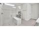 Bright bathroom featuring a glass shower, white tiles, and a built-in bench at 6105 Citrus Grove Ct, St Cloud, FL 34771