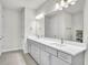 Bright bathroom featuring double vanity, tile flooring, and modern fixtures at 6105 Citrus Grove Ct, St Cloud, FL 34771