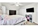 Bedroom with a bed, ceiling fan, and closet doors at 6105 Citrus Grove Ct, St Cloud, FL 34771