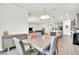 Open-concept dining room flowing into the kitchen and living area at 6105 Citrus Grove Ct, St Cloud, FL 34771