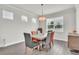 Bright dining room with natural light, table with seating, and contemporary design at 6105 Citrus Grove Ct, St Cloud, FL 34771