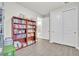 Hallway featuring a bookcase and white closet doors at 6105 Citrus Grove Ct, St Cloud, FL 34771