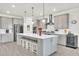 Modern kitchen with stainless steel appliances and a large center island at 6105 Citrus Grove Ct, St Cloud, FL 34771