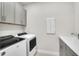 Laundry room with new machines, sink and cabinets at 6105 Citrus Grove Ct, St Cloud, FL 34771