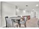 Bright living room features a table with chairs and view into the home at 6105 Citrus Grove Ct, St Cloud, FL 34771