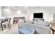 Bright living room features a comfortable couch and table with chairs at 6105 Citrus Grove Ct, St Cloud, FL 34771