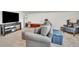 Comfortable living room features a grey couch and is decorated with furniture and accessories at 6105 Citrus Grove Ct, St Cloud, FL 34771
