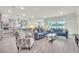 Open-concept living space with modern furnishings and hardwood floors at 6105 Citrus Grove Ct, St Cloud, FL 34771