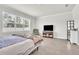 Serene bedroom with large window and a cozy seating area at 6105 Citrus Grove Ct, St Cloud, FL 34771