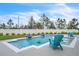 Backyard pool featuring lounge chairs and a seating area, surrounded by a well-maintained lawn at 6105 Citrus Grove Ct, St Cloud, FL 34771