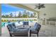 Outdoor pool and patio with built-in outdoor kitchen, ceiling fan, and seating area with attractive outdoor rug at 6105 Citrus Grove Ct, St Cloud, FL 34771