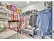 Spacious walk-in closet with ample storage racks, shelves, and hardwood floors at 6105 Citrus Grove Ct, St Cloud, FL 34771