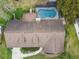 Aerial view of the home highlighting the roof and screened in pool in the backyard at 743 Riverbend Blvd, Longwood, FL 32779