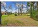 Expansive backyard with lush landscaping and scenic water view for peaceful enjoyment at 743 Riverbend Blvd, Longwood, FL 32779