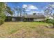 Spacious backyard with a screened pool enclosure offers plenty of room for outdoor activities at 743 Riverbend Blvd, Longwood, FL 32779
