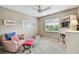 Inviting neutral bedroom features chair and ottoman with bright natural light, for relaxing at 743 Riverbend Blvd, Longwood, FL 32779