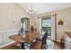 Spacious dining room with wood floors, a large window, and ample seating for Gathering gatherings at 743 Riverbend Blvd, Longwood, FL 32779