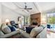Inviting living room features a brick fireplace and large windows at 743 Riverbend Blvd, Longwood, FL 32779