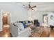 Comfortable living room with wood floors and ample seating at 743 Riverbend Blvd, Longwood, FL 32779