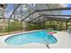 Private pool enclosed by a screened lanai, offering a refreshing escape and backyard views at 743 Riverbend Blvd, Longwood, FL 32779