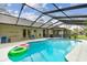 Inviting pool with screened enclosure and ample deck space for lounging and entertaining at 743 Riverbend Blvd, Longwood, FL 32779