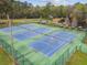 Aerial view of well-maintained tennis courts with canoe and kayak storage nearby at 743 Riverbend Blvd, Longwood, FL 32779