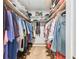 Spacious walk-in closet with built-in shelving and ample hanging space for storage at 743 Riverbend Blvd, Longwood, FL 32779