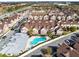 Community aerial view showcasing the pool, condos, and parking at 7558 Sunflower Cir, Kissimmee, FL 34747