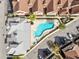 Overhead view of the community pool, buildings and parking at 7558 Sunflower Cir, Kissimmee, FL 34747
