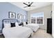 Comfortable bedroom with twin beds and decorative artwork, designed with blue accent wall at 7558 Sunflower Cir, Kissimmee, FL 34747