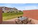 Cozy patio area with outdoor seating, perfect for enjoying the green space in the backyard at 7558 Sunflower Cir, Kissimmee, FL 34747