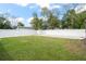 Large, well-maintained backyard features green grass and a new white fence at 7633 Marietta St, Orlando, FL 32807