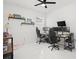 Bright bedroom with marble floors, filled with gaming setups and decorative shelving at 7633 Marietta St, Orlando, FL 32807