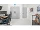 Bright bedroom with marble floors, closets and black gaming chair and desk at 7633 Marietta St, Orlando, FL 32807