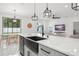 The updated kitchen offers an eat-in space with a large window overlooking the backyard at 7633 Marietta St, Orlando, FL 32807