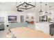 Open concept living room with a kitchen island, dining area, and comfortable seating at 7633 Marietta St, Orlando, FL 32807