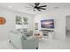 Bright living room with tile floors, comfortable seating, and natural light at 7633 Marietta St, Orlando, FL 32807