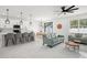Bright open-concept living space with kitchen, dining area, and modern furnishings at 7633 Marietta St, Orlando, FL 32807