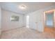 Spacious bedroom with neutral tones and an ensuite bathroom and hallway access at 858 Darwin Dr, Altamonte Springs, FL 32701