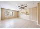 Bedroom featuring ceramic tile floor, wood paneling, and a ceiling fan at 858 Darwin Dr, Altamonte Springs, FL 32701