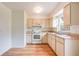 Functional kitchen with white appliances, ample cabinet space and lots of natural light at 858 Darwin Dr, Altamonte Springs, FL 32701