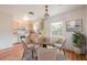 Cozy eat-in kitchen with a chandelier, warm wood floors, and stainless appliances at 858 Darwin Dr, Altamonte Springs, FL 32701
