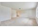 Spacious, light-filled living room with neutral carpeting and freshly painted white walls, creating a bright and inviting atmosphere at 858 Darwin Dr, Altamonte Springs, FL 32701