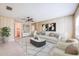 Inviting living room with wood paneling, stylish furnishings, and lots of natural light at 858 Darwin Dr, Altamonte Springs, FL 32701