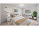 Relaxing bedroom with a large window, neutral decor, and a comfortable bed at 858 Darwin Dr, Altamonte Springs, FL 32701