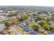 Wide aerial view of homes with lush trees, featuring one home with pool and spa, in suburban neighborhood at 872 Huckleberry Ln, Winter Springs, FL 32708