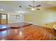 Open-concept living room with hardwood floors and stylish lighting, perfect for entertaining guests at 872 Huckleberry Ln, Winter Springs, FL 32708